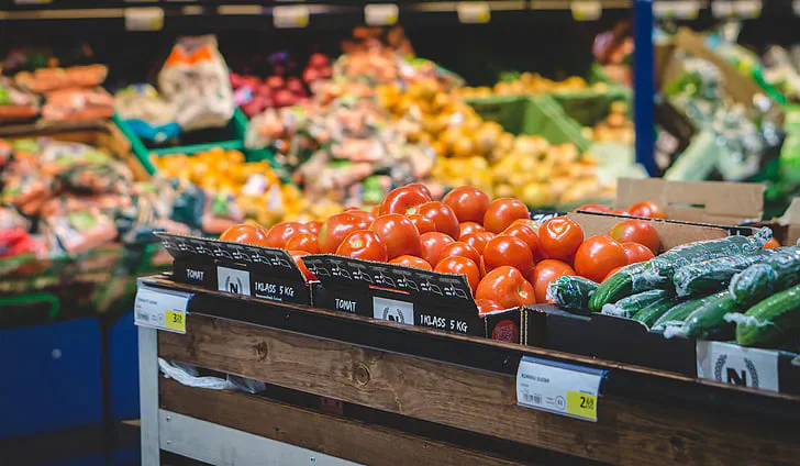Crates of tomatoes and other fresh produce.