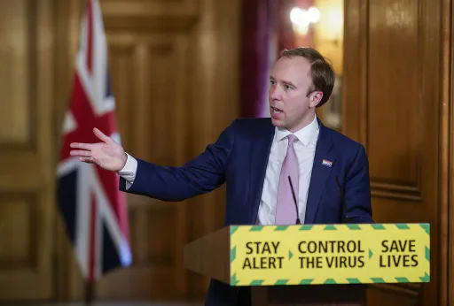 Matt Hancock at a government Covid briefing podium.