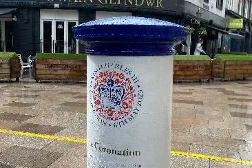 A coronation-themed postbox outside the Owain Glyndŵr pub in Cardiff.