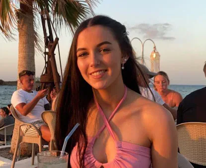 Portrait of Brianne Roberts outdoors at sunset.