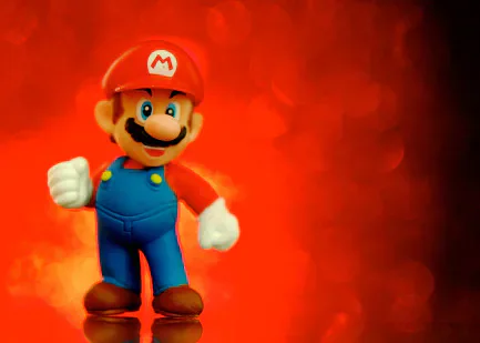 Mario giving a thumbs-up against a red background.
