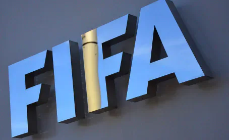 Large blue FIFA letters mounted on a wall