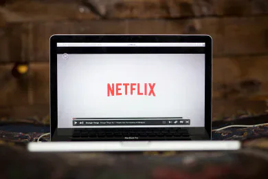A laptop displaying the Netflix logo