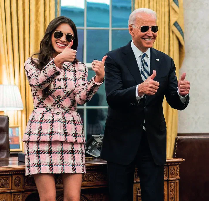 Olivia Rodrigo and Joe Biden wearing sunglasses and giving thumbs-up gestures in the Oval Office