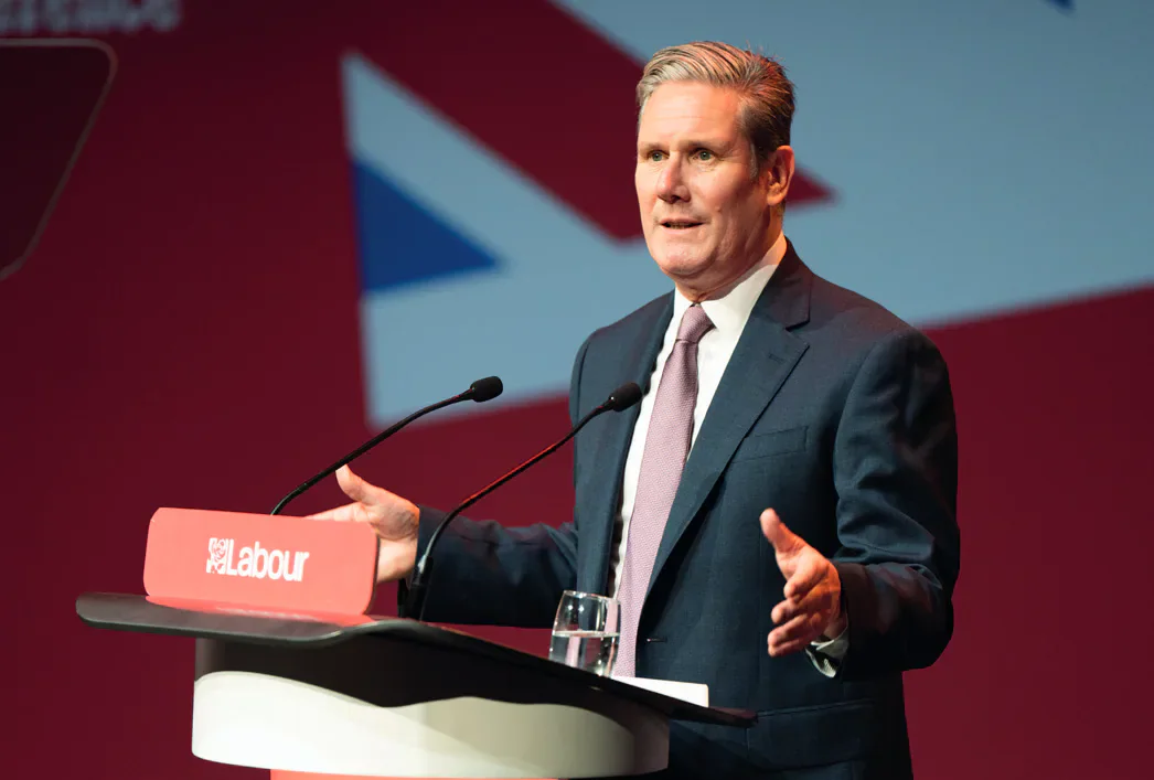 Keir Starmer speaking at a Labour podium