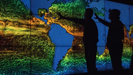 People viewing a large climate and weather visualisation