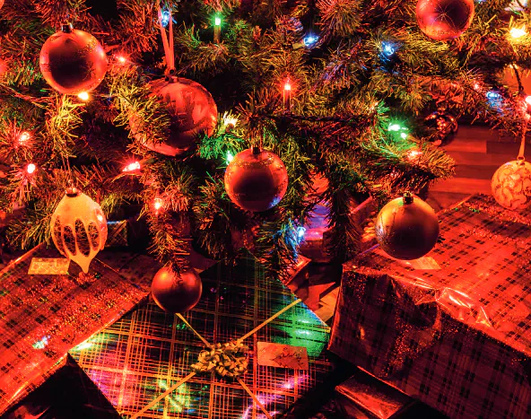 Christmas tree with red baubles and wrapped presents