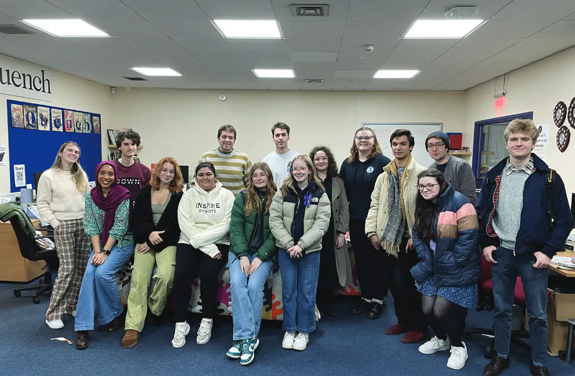 Members of both student newspapers in the media office.