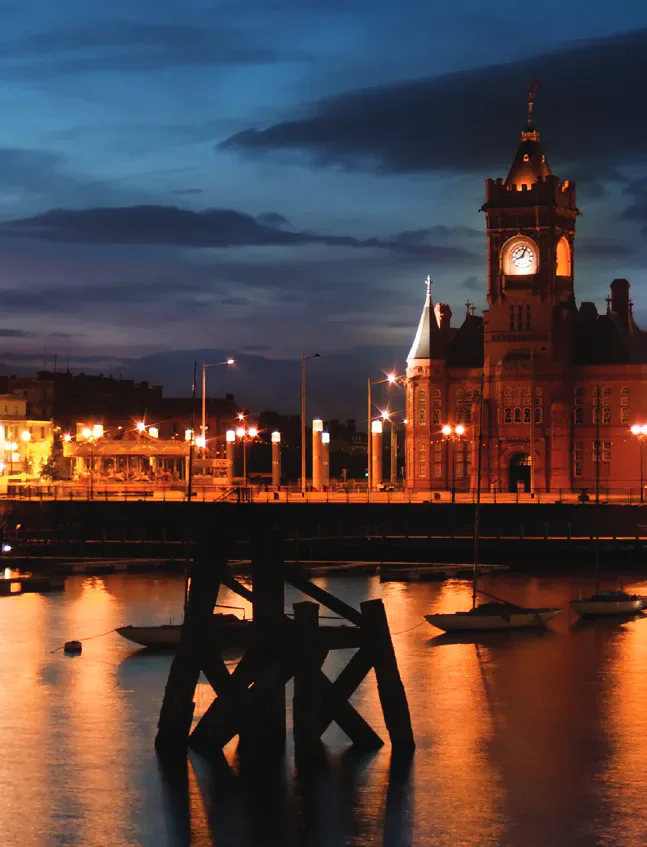 Cardiff’s Pierhead Building illuminated at night.