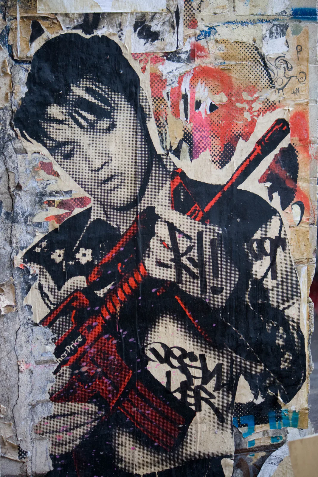 Layered street art depicting a young woman holding a red book.