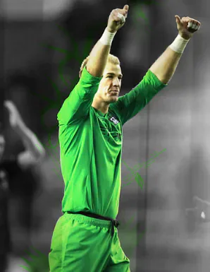 Joe Hart in a green goalkeeper kit raising both arms.
