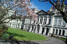 The Main Building at Cardiff University seen across the lawn.