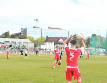 Cardiff football player taking a throw-in