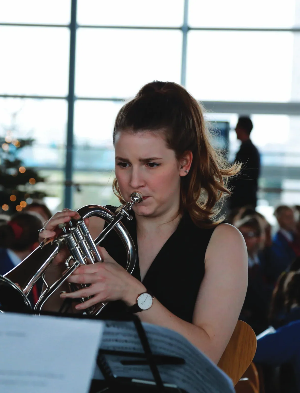 Musician performing with a brass instrument