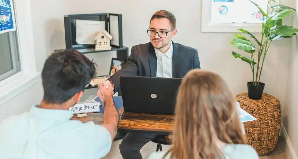 A financial adviser meeting two clients
