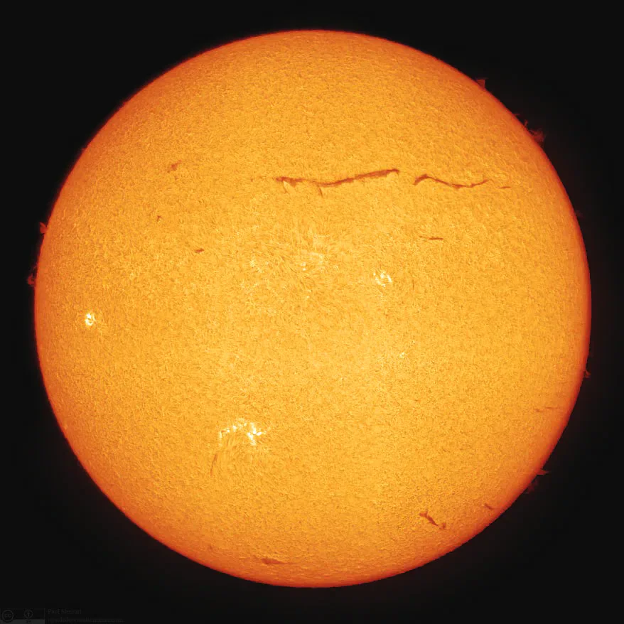 Detailed orange view of the sun against black