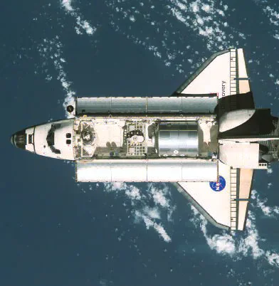 Space shuttle Discovery seen from above Earth