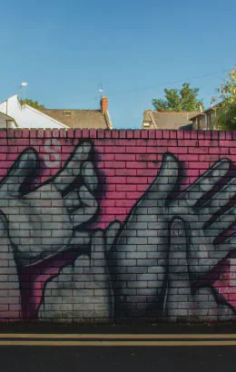British Sign Language graffiti painted on a wall