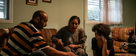 Adeeb Safadi and Ruba Blal rehearsing with director Dima Hamdan in a living room.