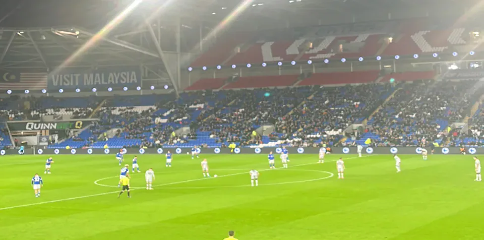 Cardiff City playing Millwall under floodlights at Cardiff City Stadium.