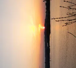 Sunset over the water at Cardiff Bay Barrage.