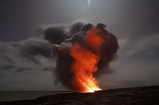 A fiery explosion producing a large column of dark smoke.