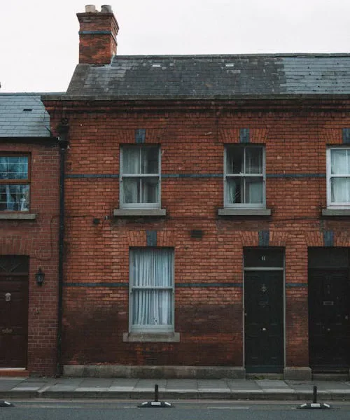 A row of red-brick terraced houses.