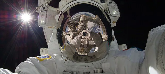 An astronaut conducting a spacewalk outside the International Space Station.