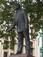 Statue of Aneurin Bevan standing outdoors on Queen Street.