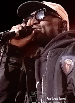 Lemfreck performing into a microphone in 2022.