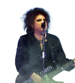 Robert Smith of The Cure singing and playing guitar on stage
