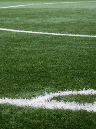 White corner lines on a green football pitch