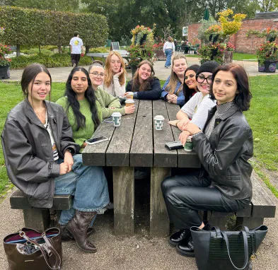 Quench members seated around a picnic table.