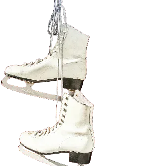 A pair of white ice skates hanging by their laces.