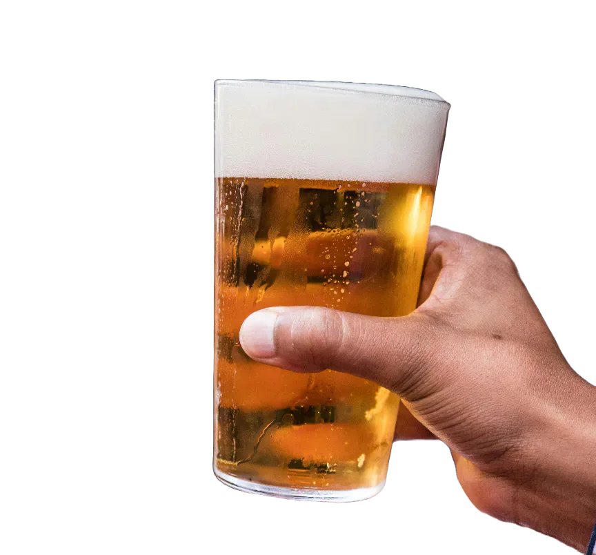 A hand holding a glass of beer.