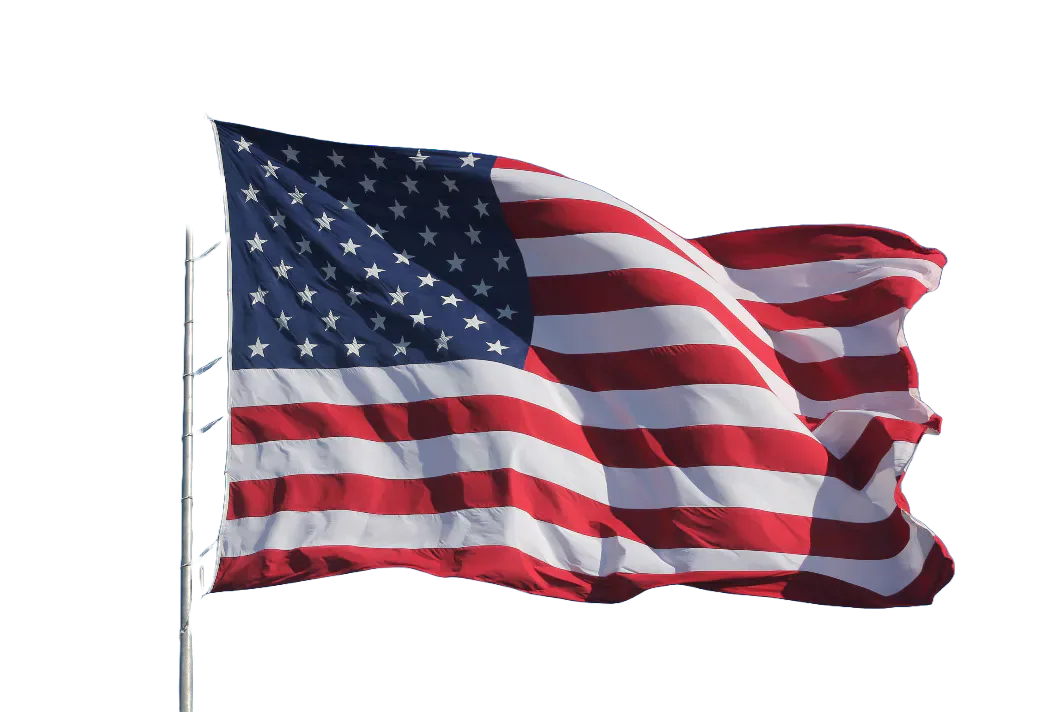 The flag of the United States flying from a pole.