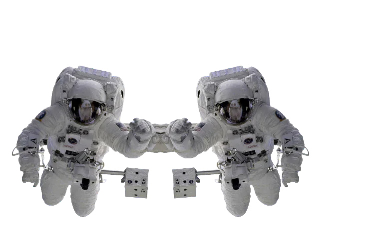 Two astronaut figures touching hands.