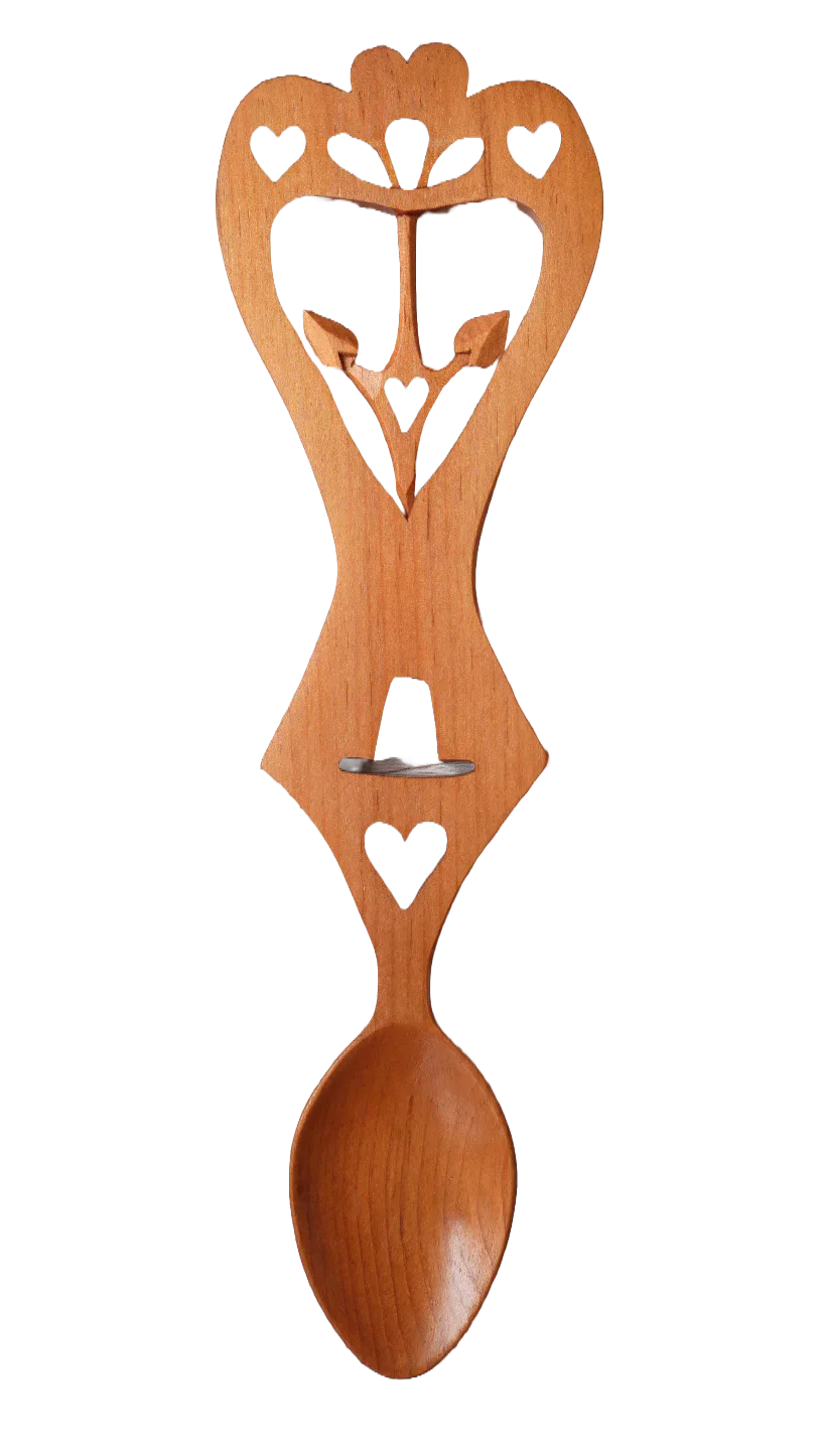 A carved wooden Welsh love spoon