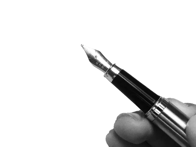 A hand holding a fountain pen