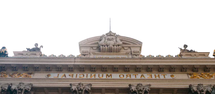 An ornate theatre façade, reflected as printed