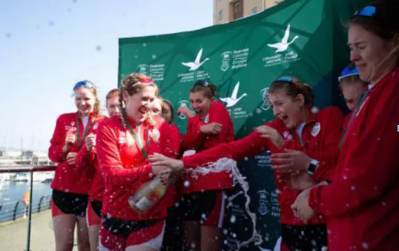 Cardiff University rowers celebrating together
