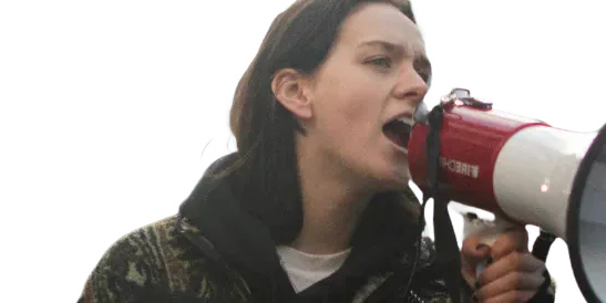 Alice Nicholson speaking through a megaphone.