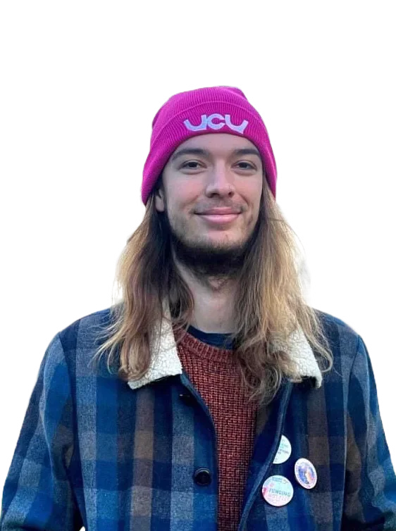 Aris Prevost wearing a pink UCU hat and a checked jacket.