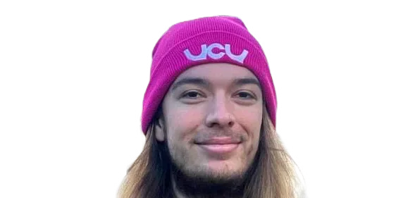 Aris Prevost wearing a pink UCU hat and a checked jacket.
