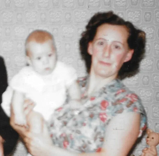 Historic family photograph of a woman holding a baby
