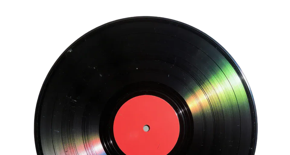 Black vinyl record with a red centre label