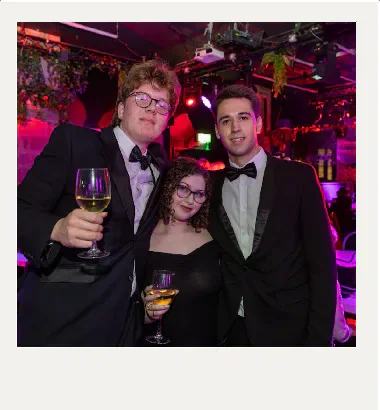 Three formally dressed attendees at the Cardiff Student Media Awards