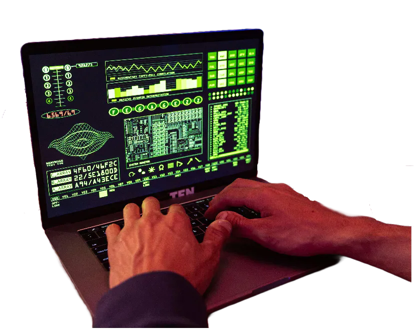 Hands using a laptop displaying computer code