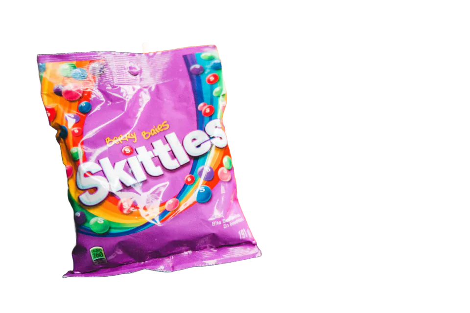 Pink packet of Skittles sweets