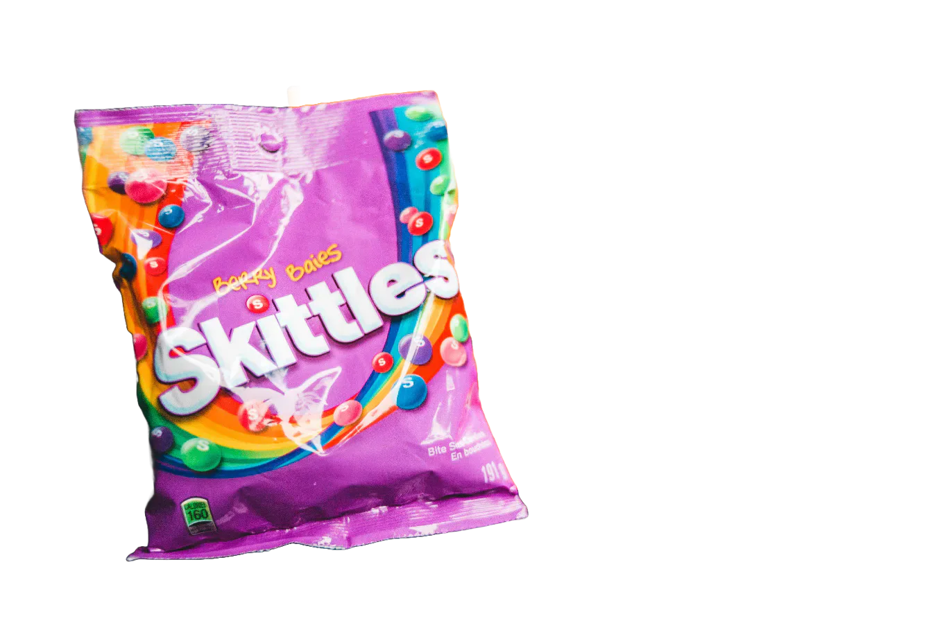 Pink packet of Skittles sweets